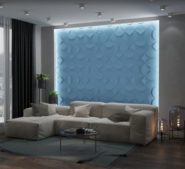 Backlit blue 3D geometric wall panel in a living room by Bhumi Decor